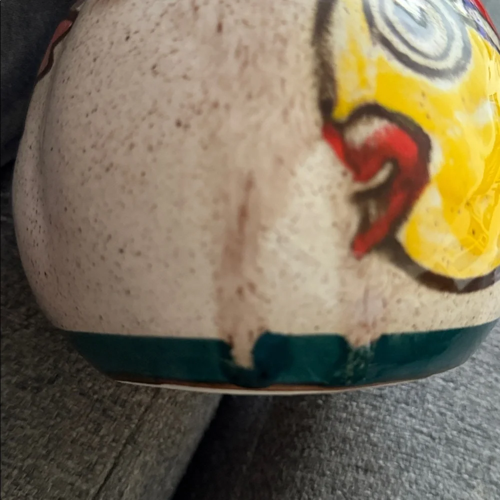 This is a vintage hand-painted ceramic pitcher 1976